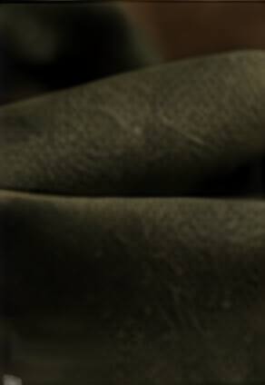 Soft folds of olive cotton canvas.