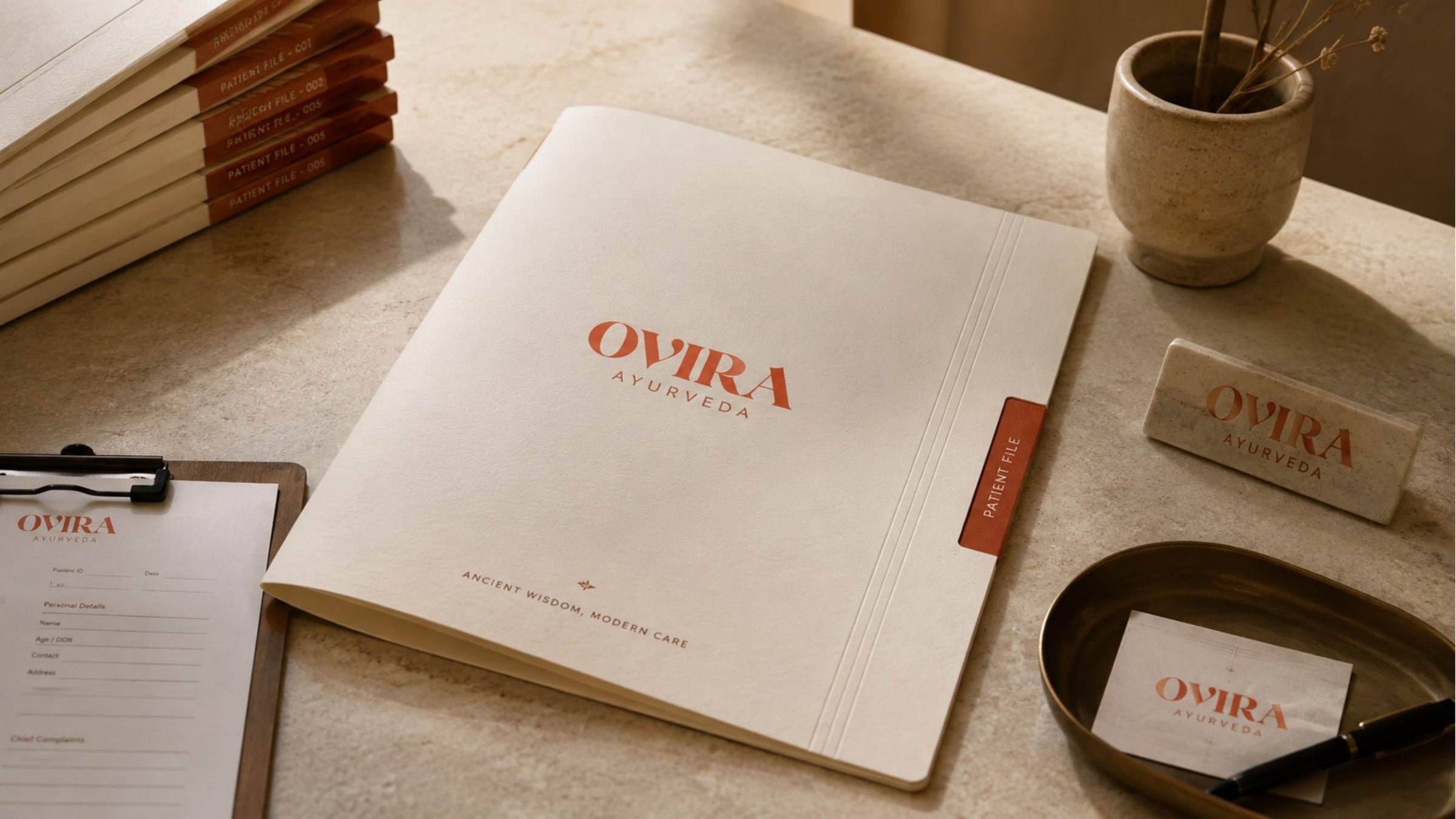 Ovira Ayurveda patient file folder, clipboard form, desk sign and card in ivory and terracotta.