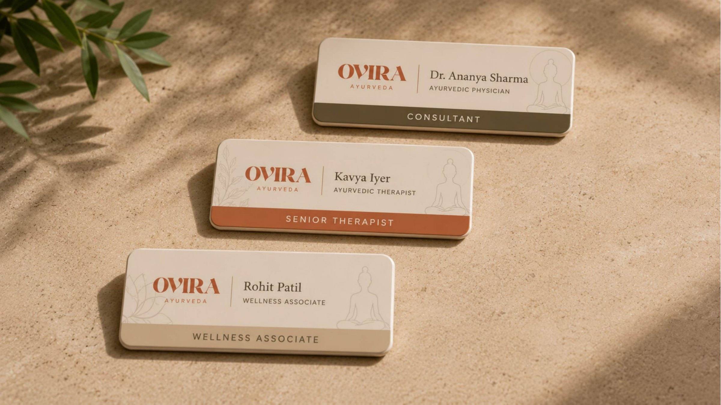 Ovira Ayurveda staff identification badges for consultant, senior therapist and wellness associate roles.