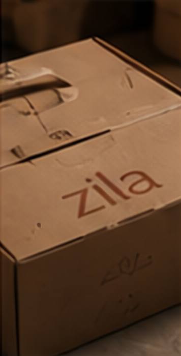 A kraft Zila shipping box with a terracotta wordmark.