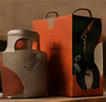 Orange and black Kori packaging beside a grey container.